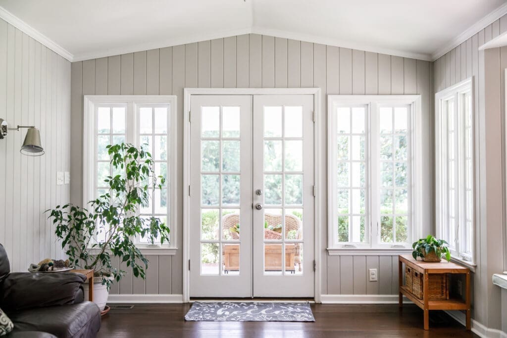 Large and open living room den sun room with windows on two side